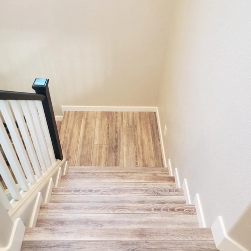 Stairs with new flooring installed by Affordable Flooring