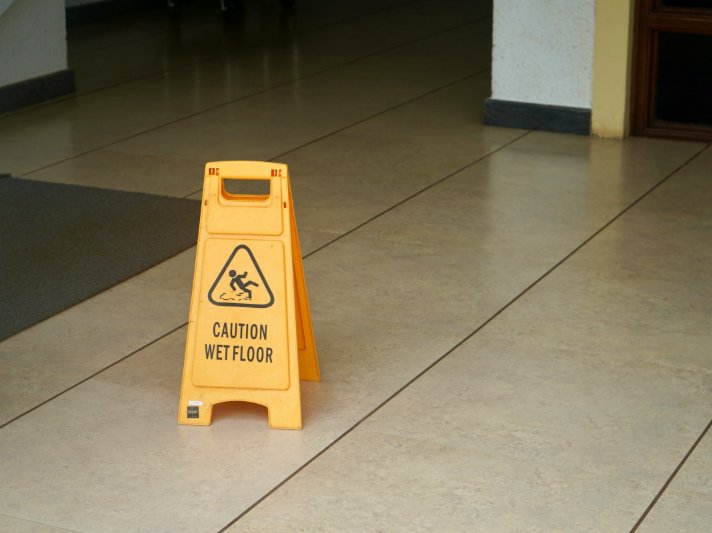 Clean Commercial Tile Floor with Caution Sign