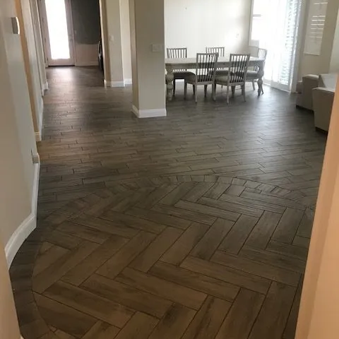Herringbone patterned dark wood floor